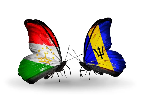 Butterflies with Tajikistan and Barbados flags — Stock Photo, Image