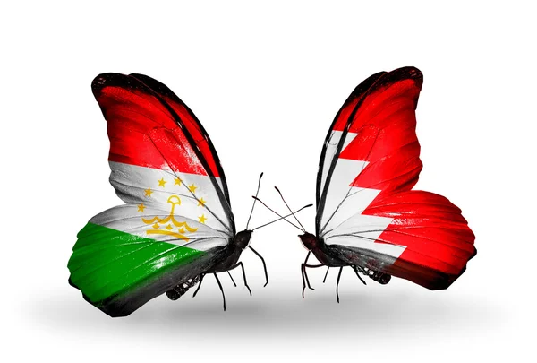 Schmetterlinge mit Tadschikistan und Bahrainflaggen — Stockfoto