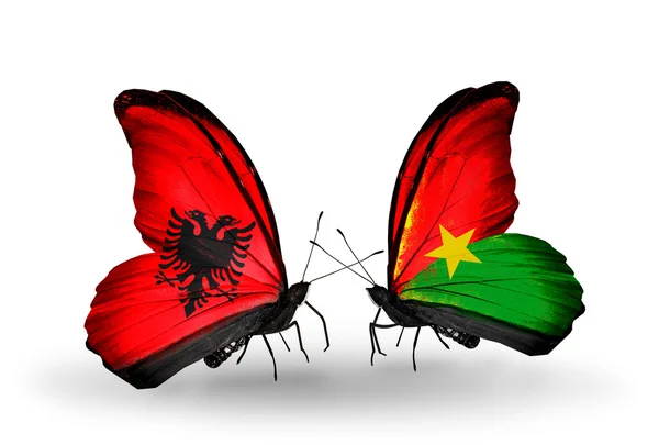 Butterflies with  Albania and Burkina Faso flags — Stock Photo, Image