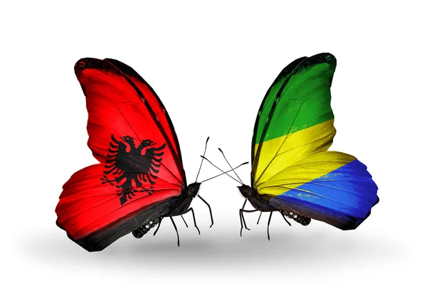 Butterflies with  Albania and Gabon flags — Stock Photo, Image