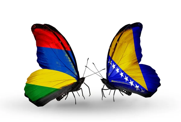 Butterflies with Mauritius and Bosnia and Herzegovina flags — Stock Photo, Image