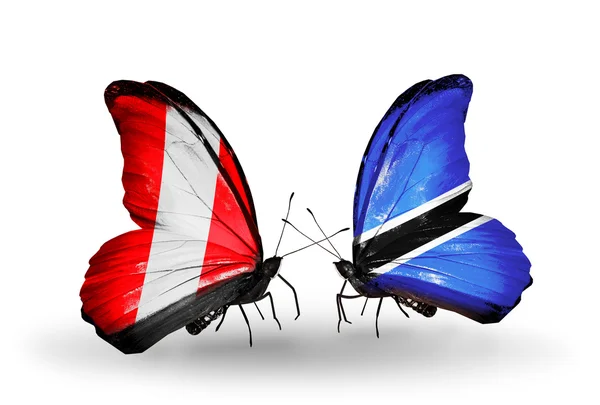 Motyle z peru i botswana flagi — Zdjęcie stockowe