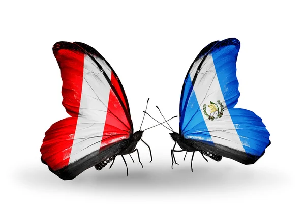 Borboletas com bandeiras Peru e Guatemala — Fotografia de Stock