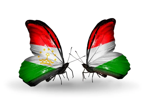 Borboletas com bandeiras do Tajiquistão e da Hungria — Fotografia de Stock