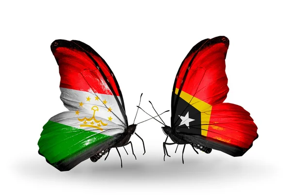 Butterflies with Tajikistan and East Timor flags — Stock Photo, Image