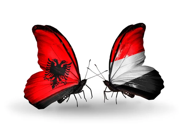 Butterflies with Albania and Yemen flags — Stock Photo, Image