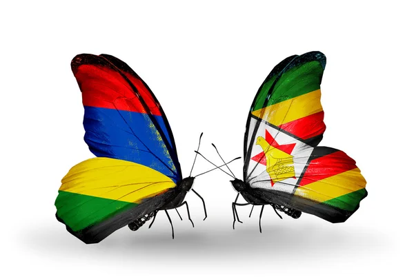 Mariposas con banderas de Mauricio y Zimbabwe —  Fotos de Stock