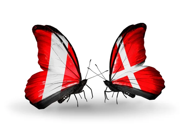 Butterflies with Peru and Denmark flags — Stock Photo, Image