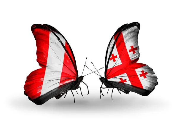 Butterflies with Peru and Georgia flags — Stock Photo, Image