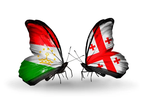 Butterflies with Tajikistan and  Georgia flags — Stock Photo, Image