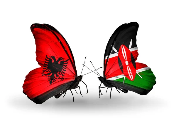 Бабочки с флагами Албании и Кении — стоковое фото