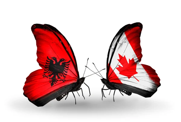 Butterflies with Albania and  Canada flags — Stock Photo, Image