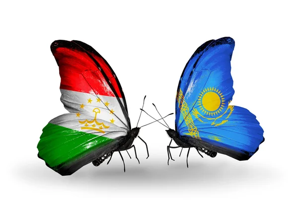 Butterflies with Tajikistan and Kazakhstan flags — Stock Photo, Image