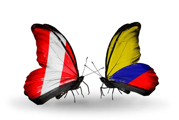 Butterflies with Peru and Columbia flags — Stock Photo, Image