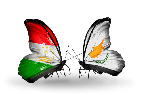 Mariposas con banderas de Tayikistán y Chipre — Foto de Stock