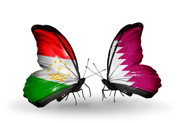 Papillons avec drapeaux du Tadjikistan et du Qatar — Photo