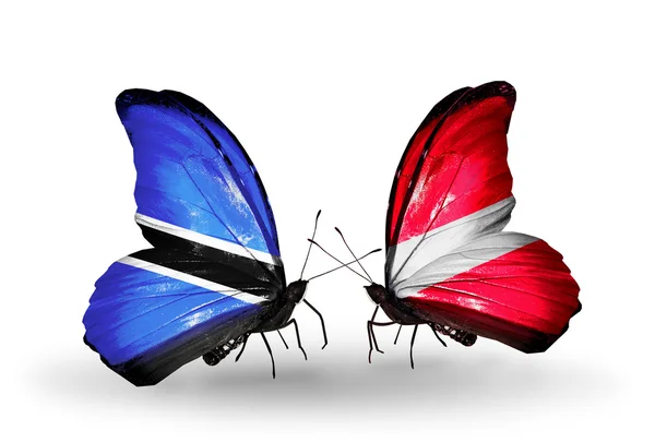 Butterflies with Botswana and Latvia flags — Stock Photo, Image