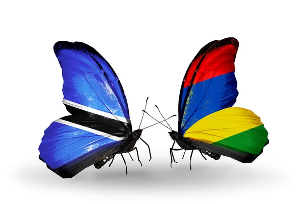 Farfalle con bandiere Botswana e Mauritius — Foto Stock