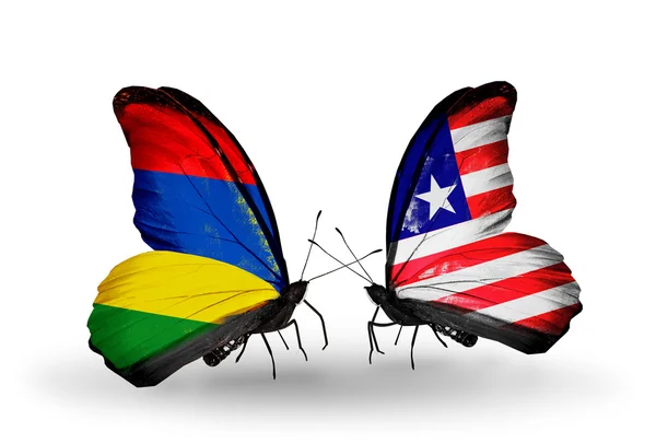 Schmetterlinge mit Mauritius- und Liberia-Fahnen — Stockfoto