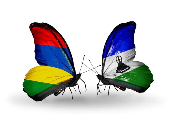 Farfalle con bandiere Mauritius e Lesotho — Foto Stock