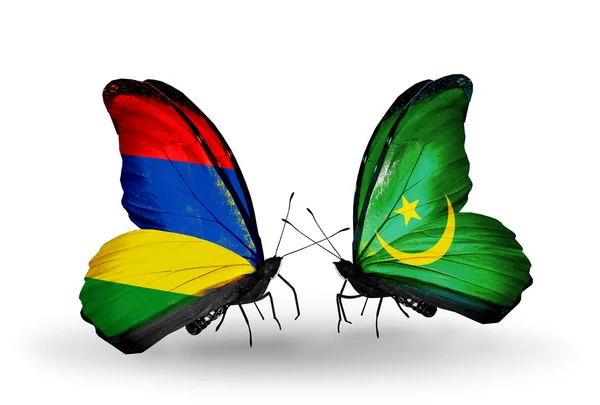 Farfalle con bandiere Mauritius e Mauritania — Foto Stock