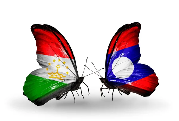蝴蝶与塔吉克斯坦和老挝国旗 — 图库照片