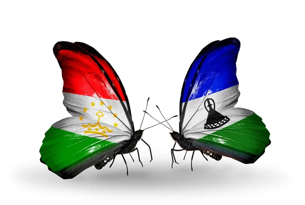 Бабочки с флагами Таджикистана и Лесото — стоковое фото