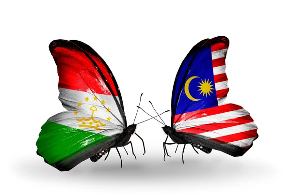 Butterflies with Tajikistan and Malaysia flags — Stock Photo, Image