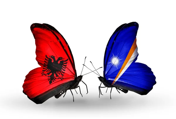 Butterflies with Albania and Marshall islands flags — Stock Photo, Image