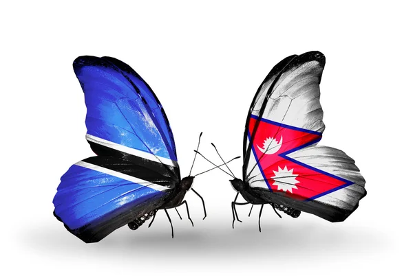 Farfalle con bandiere Botswana e Nepal — Foto Stock