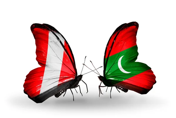 Vlinders met peru en Maldiven vlaggen — Stockfoto
