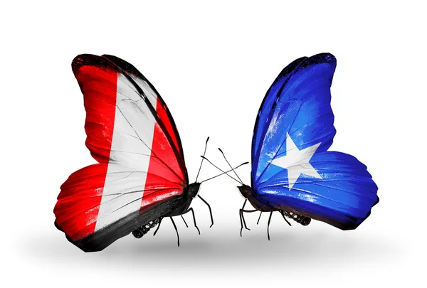 Butterflies with Peru and Somalia flags — Stock Photo, Image