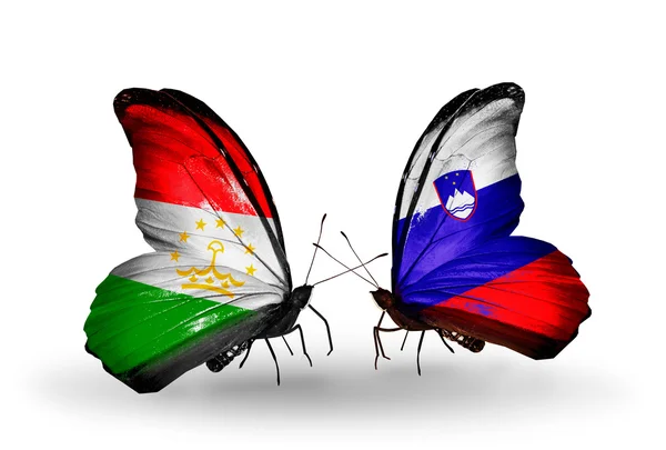 Mariposas con banderas de Tayikistán y Eslovenia — Foto de Stock