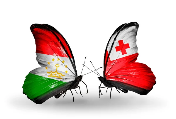 Butterflies with Tajikistan and Tonga flags — Stock Photo, Image