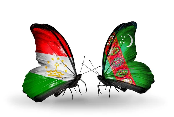 Butterflies with Tajikistan and Turkmenistan flags — Stock Photo, Image