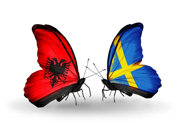 Butterflies with Albania and Sweden flags — Stock Photo, Image