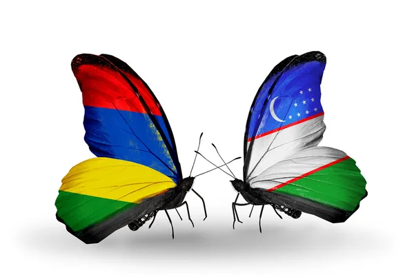 Butterflies with Mauritius and Uzbekistan flags — Stock Photo, Image