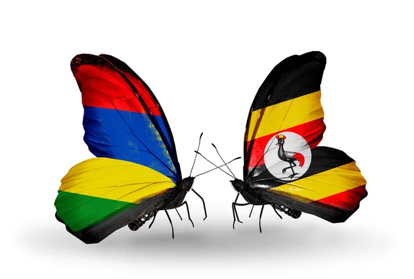 Motyle z mauritius i uganda flagi — Zdjęcie stockowe
