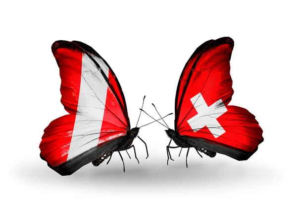 Mariposas con banderas de Perú y Suiza — Foto de Stock