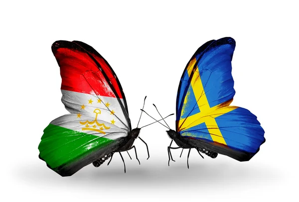 Butterflies with Tajikistan and Sweden flags — Stock Photo, Image