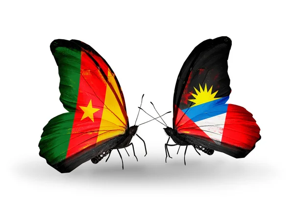 Butterflies with Cameroon and Antigua and Barbuda flags — Stock Photo, Image