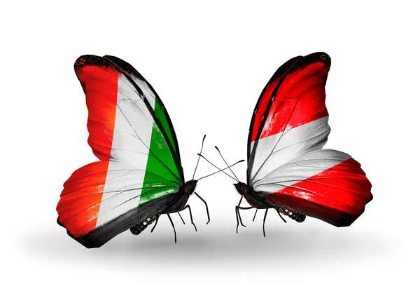 Butterflies with Cote Divoire and Austria flags — Stock Photo, Image