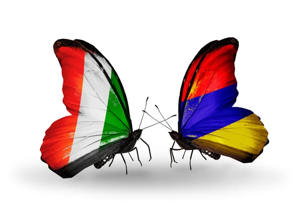 Butterflies with Cote Divoire and Armenia flags — Stock Photo, Image