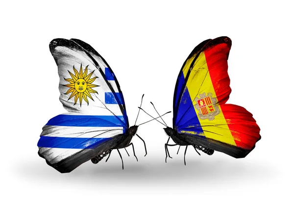 Butterflies with Uruguay and Andorra flags — Stock Photo, Image