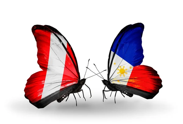 Butterflies with Peru and Philippines flags — Stock Photo, Image