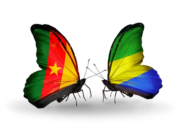 Fjärilar med Kamerun och gabon flaggor — Stockfoto