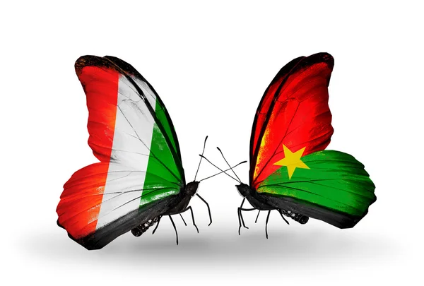 Butterflies with Cote Divoire and Burkina Faso flags — Stock Photo, Image