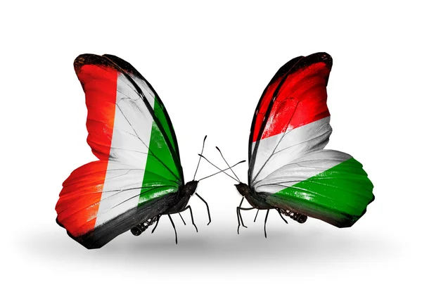 Butterflies with Cote Divoire and Hungary flags — Stock Photo, Image