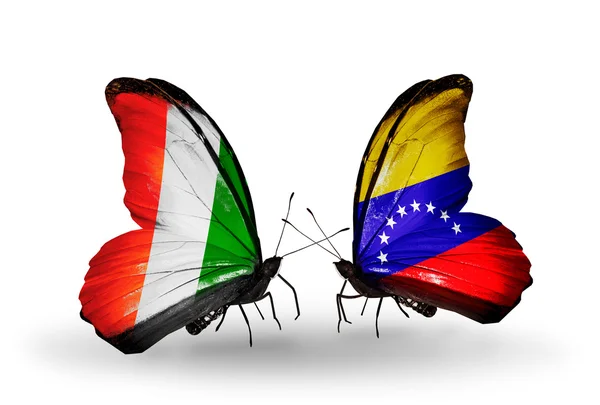 Butterflies with Cote Divoire and Venezuela flags — Stok fotoğraf