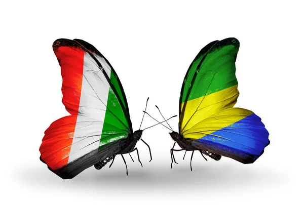 Motyle z flagami Wybrzeże Kości Słoniowej wyspa i gabon flagi — Zdjęcie stockowe